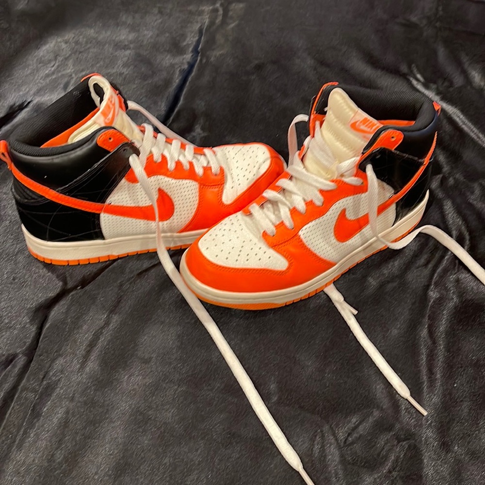Nike Dunk High SB size 9.5 women’s. Black, white & bright orange swoosh.